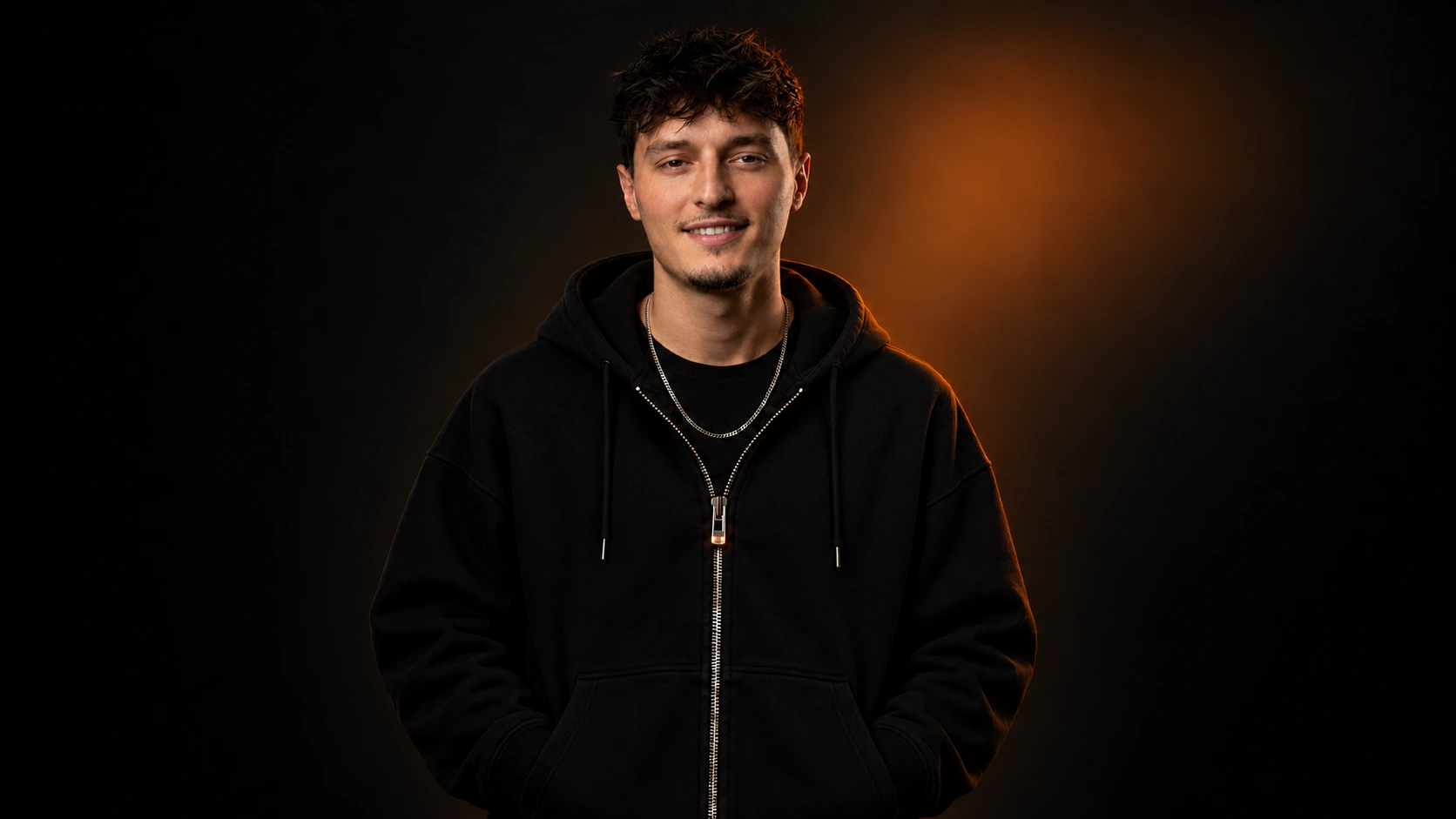 Nikolai Savic in a black zip hoodie